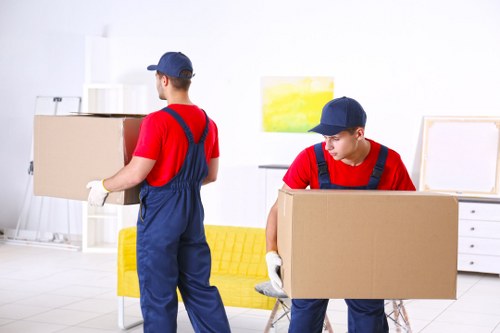 Removal van and moving boxes outside a Brixton home