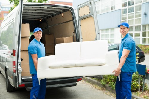 Local removals team working near Brixton with moving van and boxes