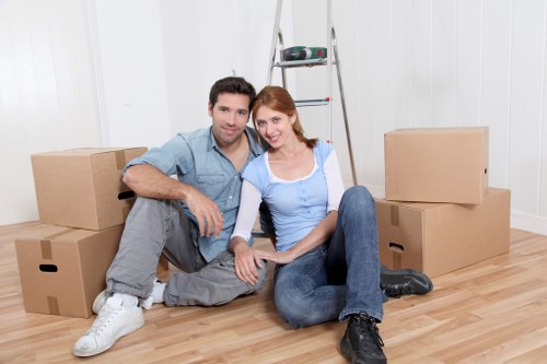 Local movers organising labelled boxes for a Brixton relocation