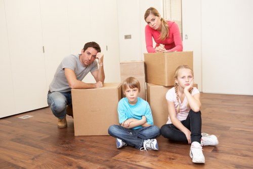 Unloading moving boxes and furniture at a Brixton property