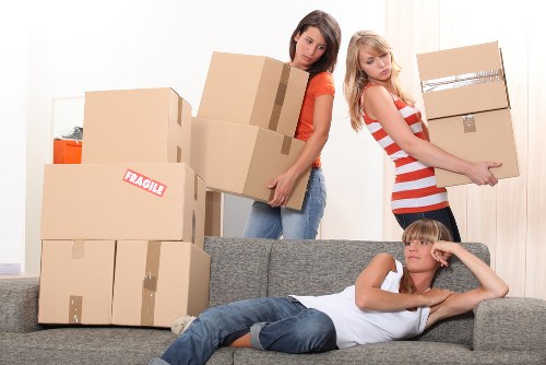 Unpacking boxes in a Brixton flat after moving day